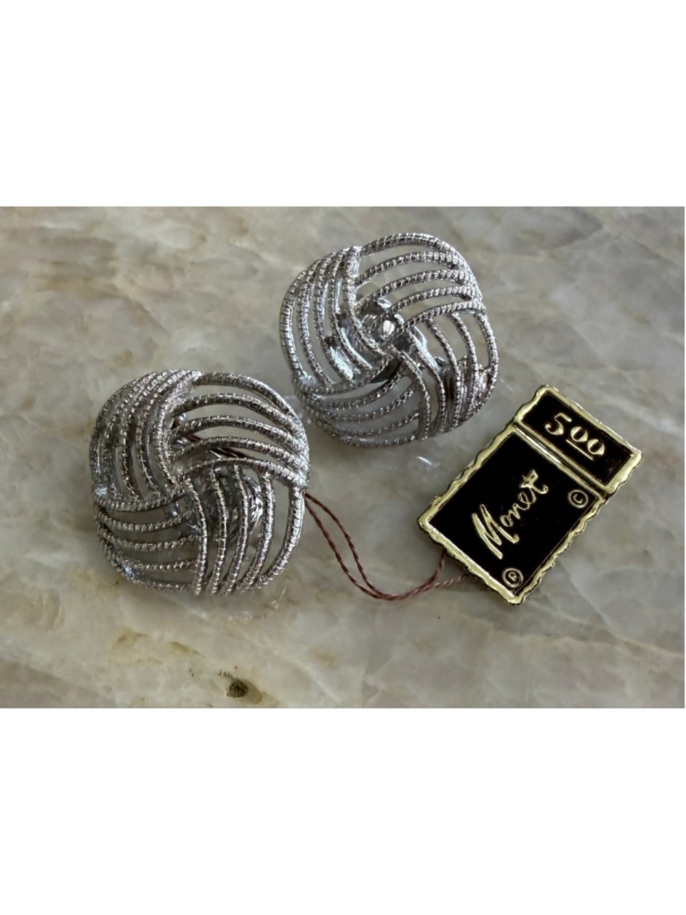 Monet Silver Tone Swirl Clip-On Earrings with original jewelry store tag signed